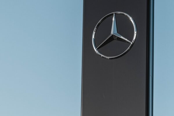 Mercedes-Benz signage under clear blue sky