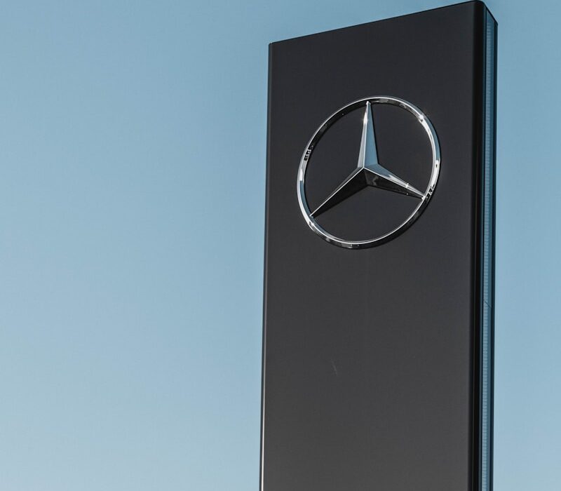 Mercedes-Benz signage under clear blue sky