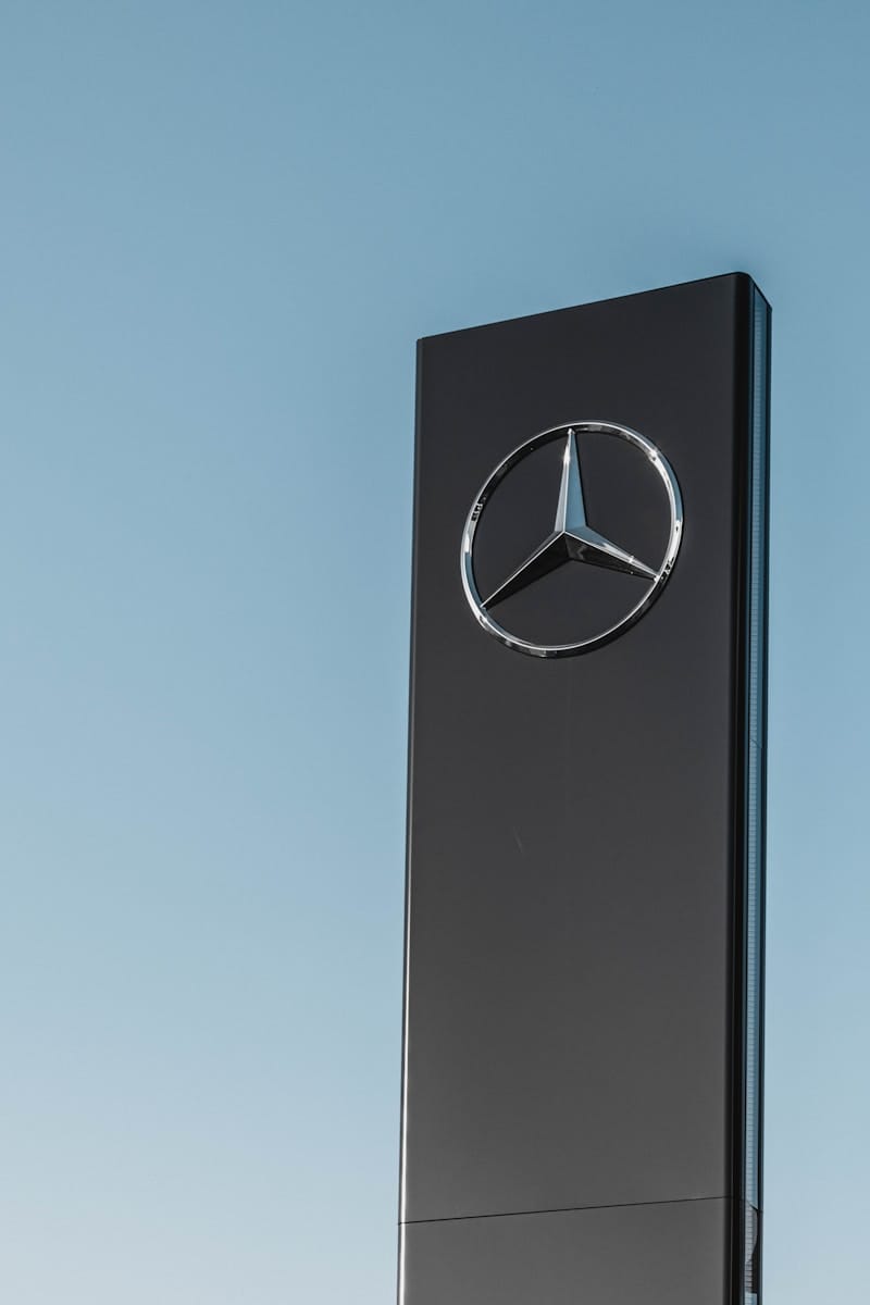 Mercedes-Benz signage under clear blue sky