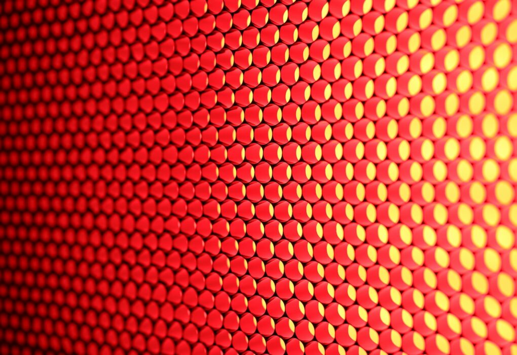 a close up of a red and yellow background